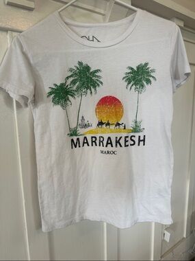 Chaser White Tee with Green Palm Trees and Red-Orange Sunset Graphic